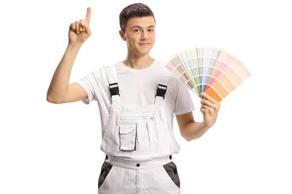 Joven Pintor Correo Sosteniendo Una Paleta Muestras Color Apuntando Hacia —  Fotos de Stock