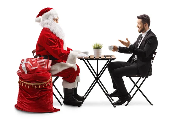 Święty Mikołaj Biznesmen Rozmawiający Przy Stoliku Kawiarni Białym Tle — Zdjęcie stockowe