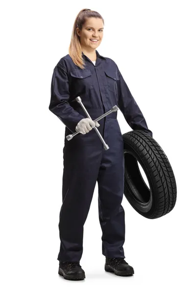 Female Auto Mechanic Worker Holding Tire Lug Wrench Isolated White — Stock Photo, Image