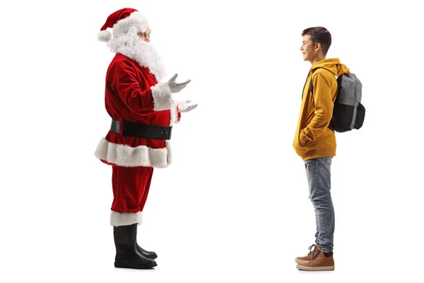 Święty Mikołaj Stojący Rozmawiający Nastoletnim Studentem Odizolowanym Białym Tle — Zdjęcie stockowe