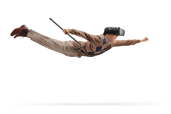 Hombre Mayor Con Auricular Sosteniendo Bastón Volando Aislado Sobre Fondo —  Fotos de Stock