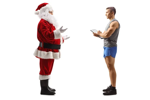 Święty Mikołaj Rozmawia Trenerem Fitness Białym Tle — Zdjęcie stockowe