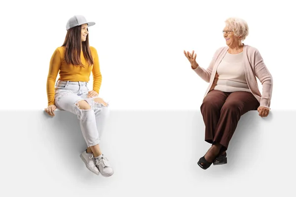 Young Elderly Female Sitting Blank Panel Having Conversation Isolated White — Stock Photo, Image