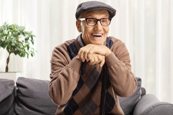 Cheerful Elderly Man Leaning Cane Sitting Sofa — Stock Photo, Image