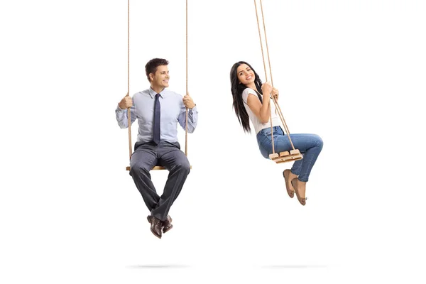 Man Sitting Swing Looking Beautiful Young Woman Swinging Isolated White — Stock Photo, Image