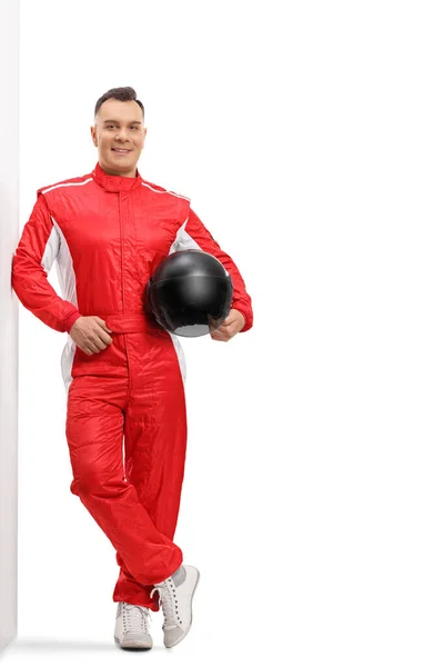 Full Length Portrait Racer Red Suit Leaning Wall Holding Black — Stock Photo, Image