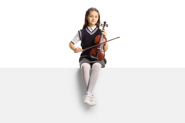 Schoolgirl Sitting Blank Panel Holding Violin Isolated White Background — Stock Photo, Image