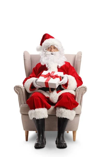 Full Length Portrait Santa Claus Sitting Armchair Present His Hands — Stockfoto