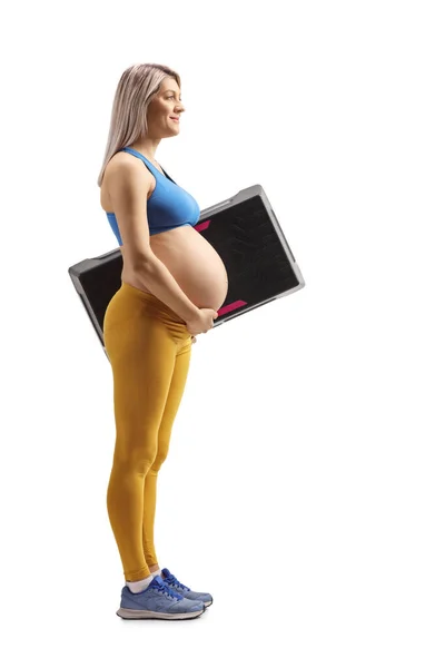 Foto Perfil Completo Una Mujer Embarazada Ropa Deportiva Sosteniendo Platofrm — Foto de Stock