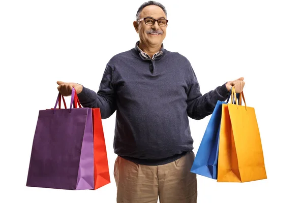 Mature Man Holding Shopping Bags Smiling Isolated White Background — Stockfoto