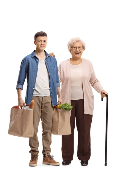 Young Man Helping Elderly Woman Carrying Grocery Bags Isolated White — Stock Photo, Image