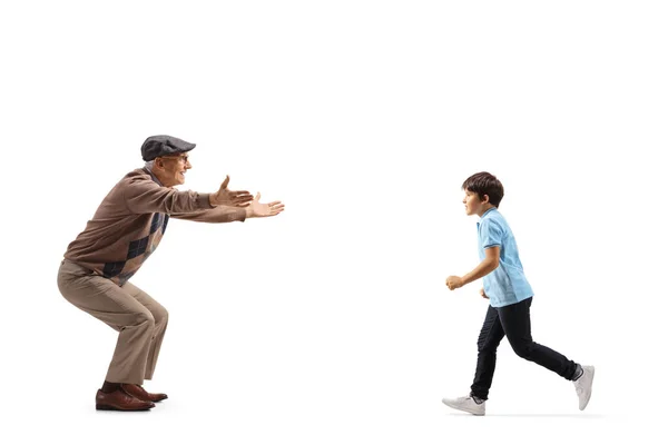 Full Length Profile Shot Boy Running Hug His Grandfather Isolated — Fotografia de Stock