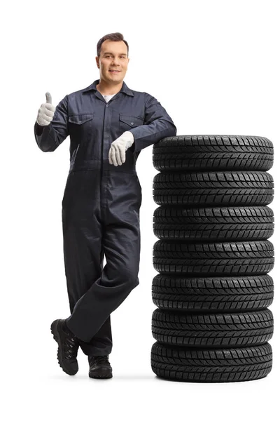 Auto Mechanic Worker Uniform Leaning Pile Tires Showing Thumb Gesture — Fotografia de Stock