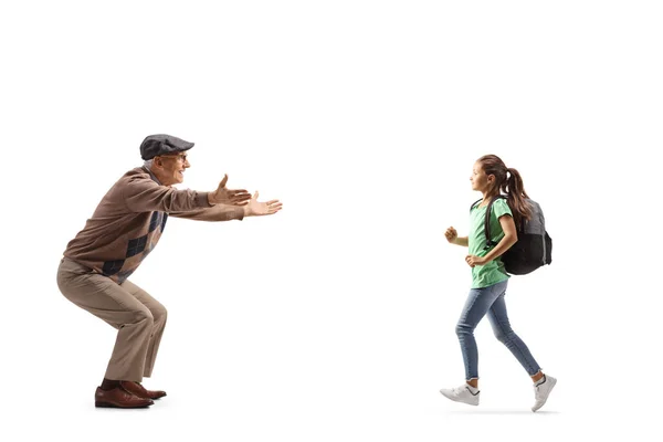 Full Length Profile Shot Child Backpack Running Elderly Man Isolated — Stockfoto