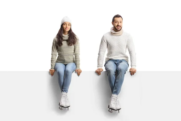 Young Man Woman Sitting Blank Panel Wearing Ice Skates Isolated — Stock Photo, Image