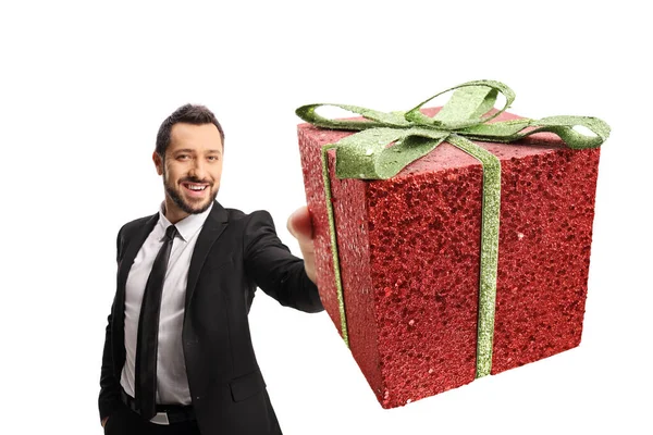 Businessman Holding Red Glittery Present Isolated White Background — Stockfoto