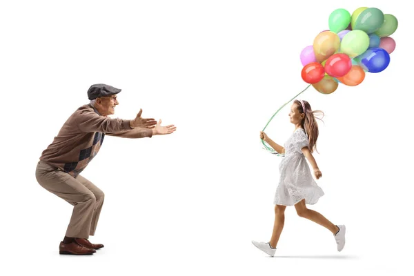 Full Length Profile Shot Girl Balloons Running Grandfather Isolated White — Fotografia de Stock