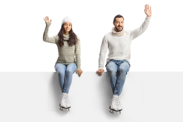 Young Man Woman Ice Skates Sitting Blank Panel Waving Isolated — Stock Photo, Image