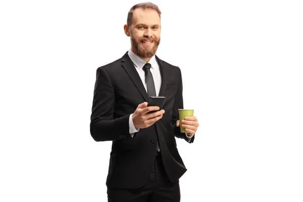 Young Businessman Holding Takeaway Coffee Cup Smartphone Isolated White Background — стоковое фото