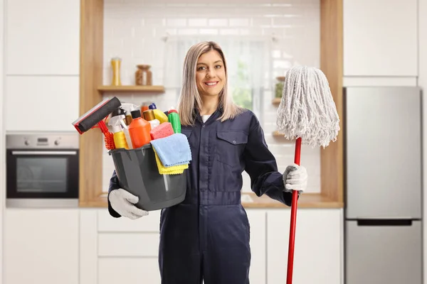 Young Female Cleaner Uniform Holding Bucket Cleaning Supplies Mop Kitchen — стоковое фото