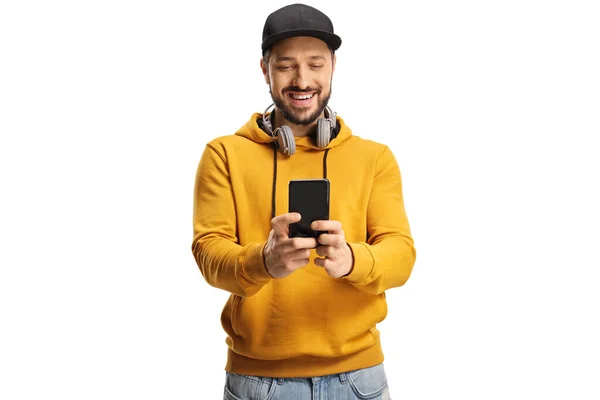 Smiling Young Man Headphones Neck Cap Using Smartphone Smiling Isolated — Stock fotografie