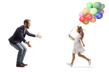 Full length profile shot of a girl with balloons running towards her father isolated on white background