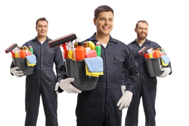 Professional male cleaners in usniform holding bucket with cleaning supplies isolated on white background