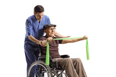 Helathcare worker helping an elderly man in a wheelchair exercising with a stretch band isolated on white background
