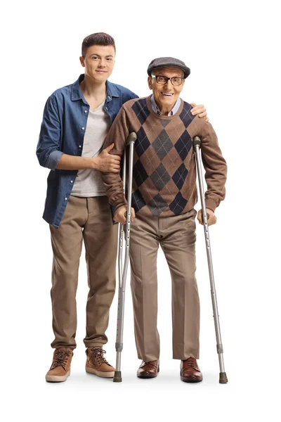 Young Man Helping Elderly Man Walking Crutches Isolated White Background — Photo