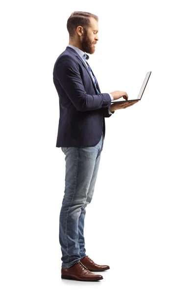 Full Length Profile Shot Man Holding Laptop Computer Isolated White — Stock fotografie