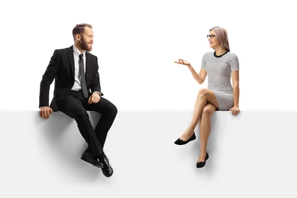 Businessman Casual Young Woman Having Conversation Blank Panel Isolated White — Φωτογραφία Αρχείου