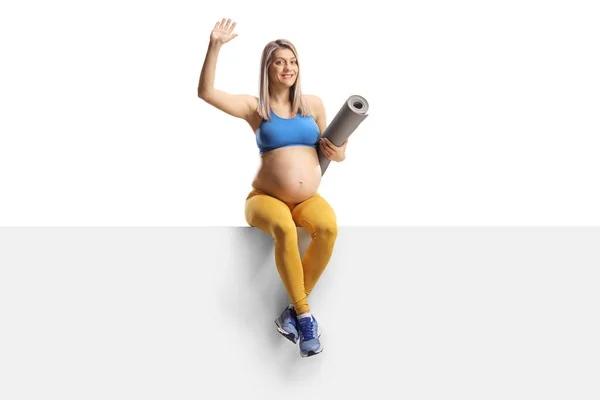 Pregnant Woman Sportswear Exercise Mat Sitting Blank Panel Waving Isolated — Stock fotografie