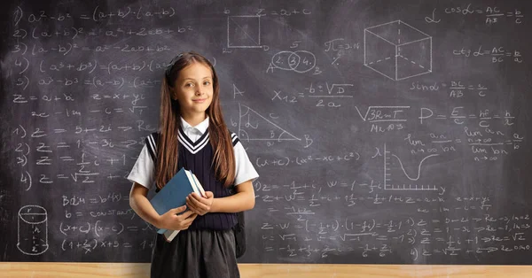 Schoolgirl Uniform Holding Book Front Chalkboard Mathematical Formulas — Stock Photo, Image