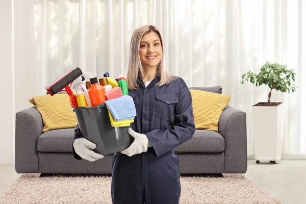 Young Female Cleaner Uniform Holding Bucket Front Couch — Stock Photo, Image