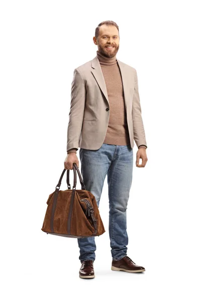 白を基調としたバッグを持つベージュのスーツとジーンズのプロの男の完全な長さの肖像画 — ストック写真