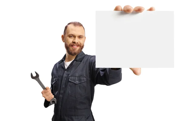 Mechanic Uniform Holding Wrench Small Blank Card Isolated White Background — Stock Photo, Image