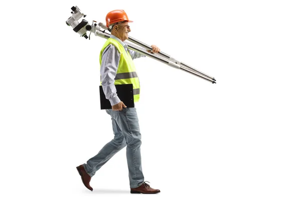 Full Length Profile Shot Engineer Walking Carrying Measuring Instrument Isolated — Stock Photo, Image