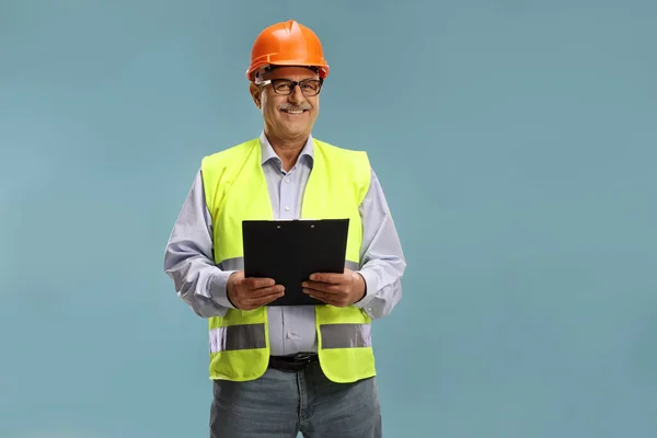 Construction Site Engineer Reflective Vest Isolated Blue Background — Stock Photo, Image