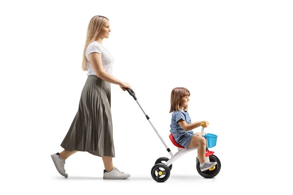 Full Length Profile Shot Mother Pushing Girl Tricycle Isolated White — Stock Photo, Image