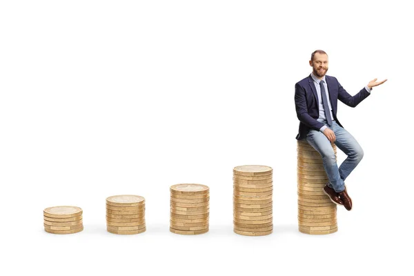 Young Professional Man Sitting Pile Coins Gesturing Hand Isolated White — Stock Photo, Image