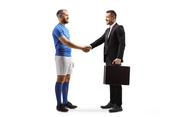 足球运动员和商人在白色背景下相互握手 — 图库照片