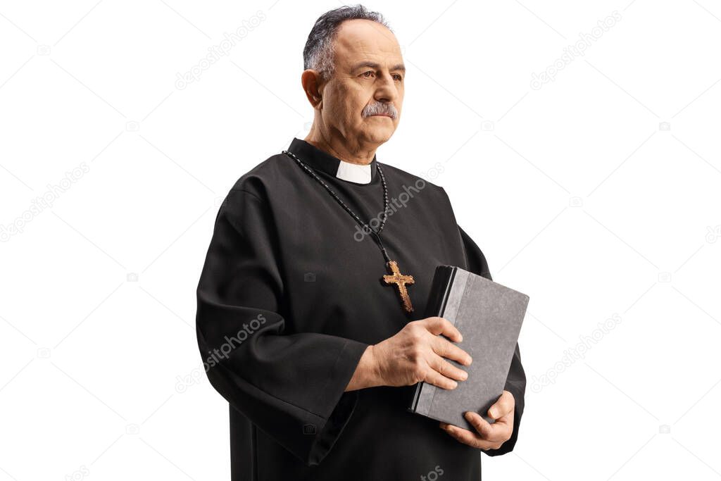 Mature priest holding a bible isolated on white background