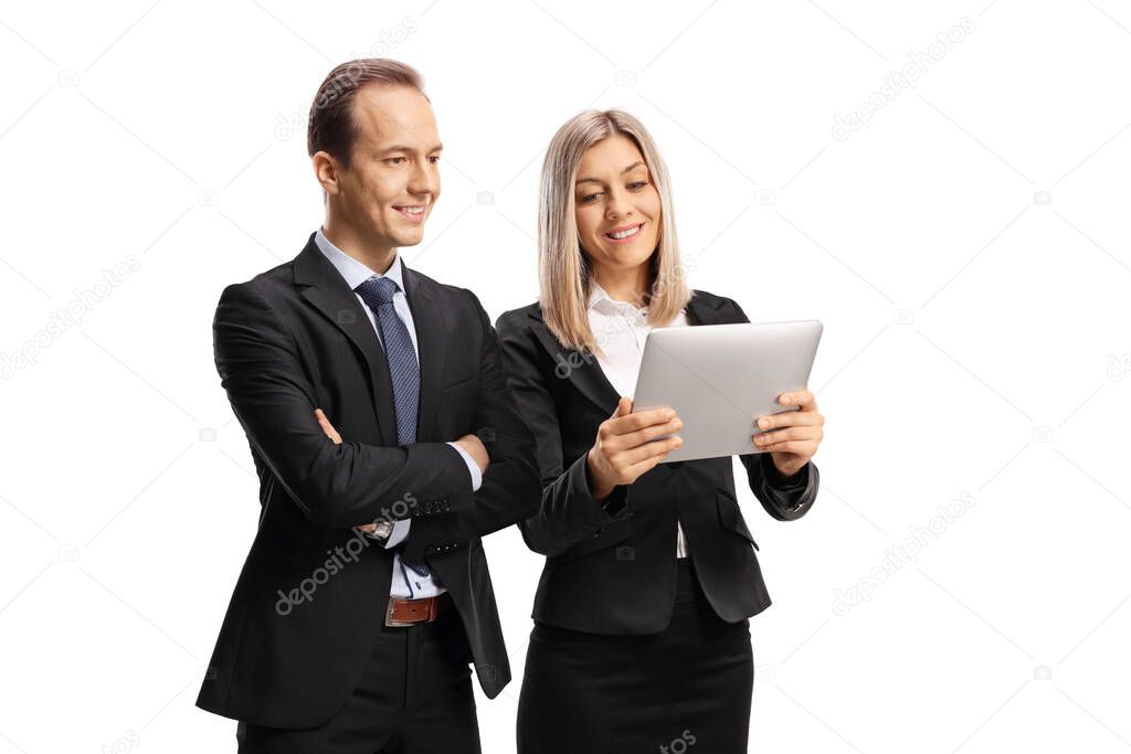 Businessman and businesswoman looking at a digital tablet isolated on white background