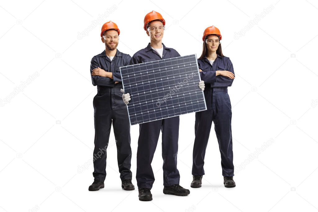Team of workers in uniforms presenting a solar panel isolated on white background