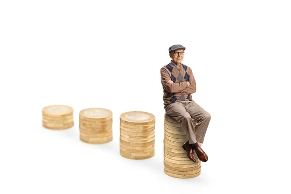 Senior Man Seated Rising Piles Coins Isolated White Background — Stock Photo, Image