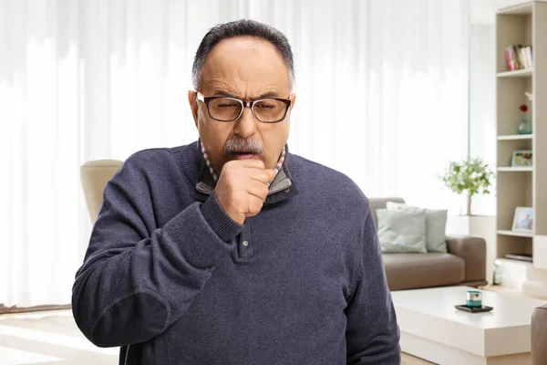 Mature Man Caughing Home Living Room — Stock Photo, Image