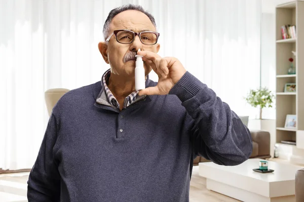 Mature Man Using Nasal Spray Home Living Room — Stock Photo, Image