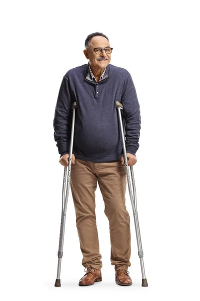 Cheerful Mature Man Standing Crutches Isolated White Background — Stock Photo, Image