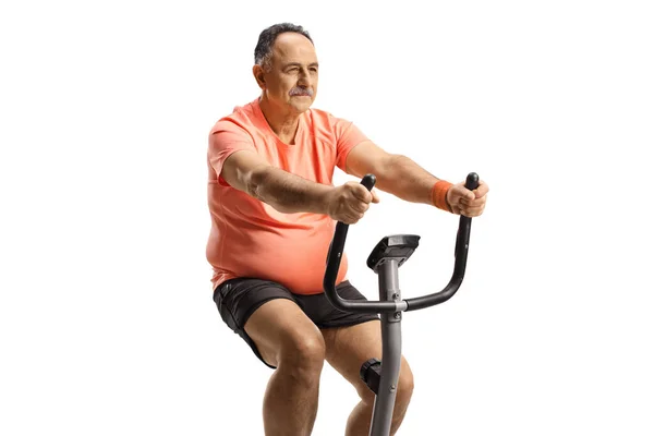 Mature Man Exercising Stationary Bike Isolated White Background — Stock Photo, Image