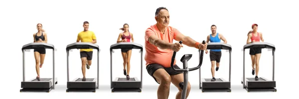 Mature Man Exercising Stationary Bike People Running Treadmills Isolated White — Stock Photo, Image